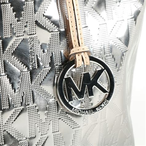 michael kors bag charm silver|Michael Kors leather bags.